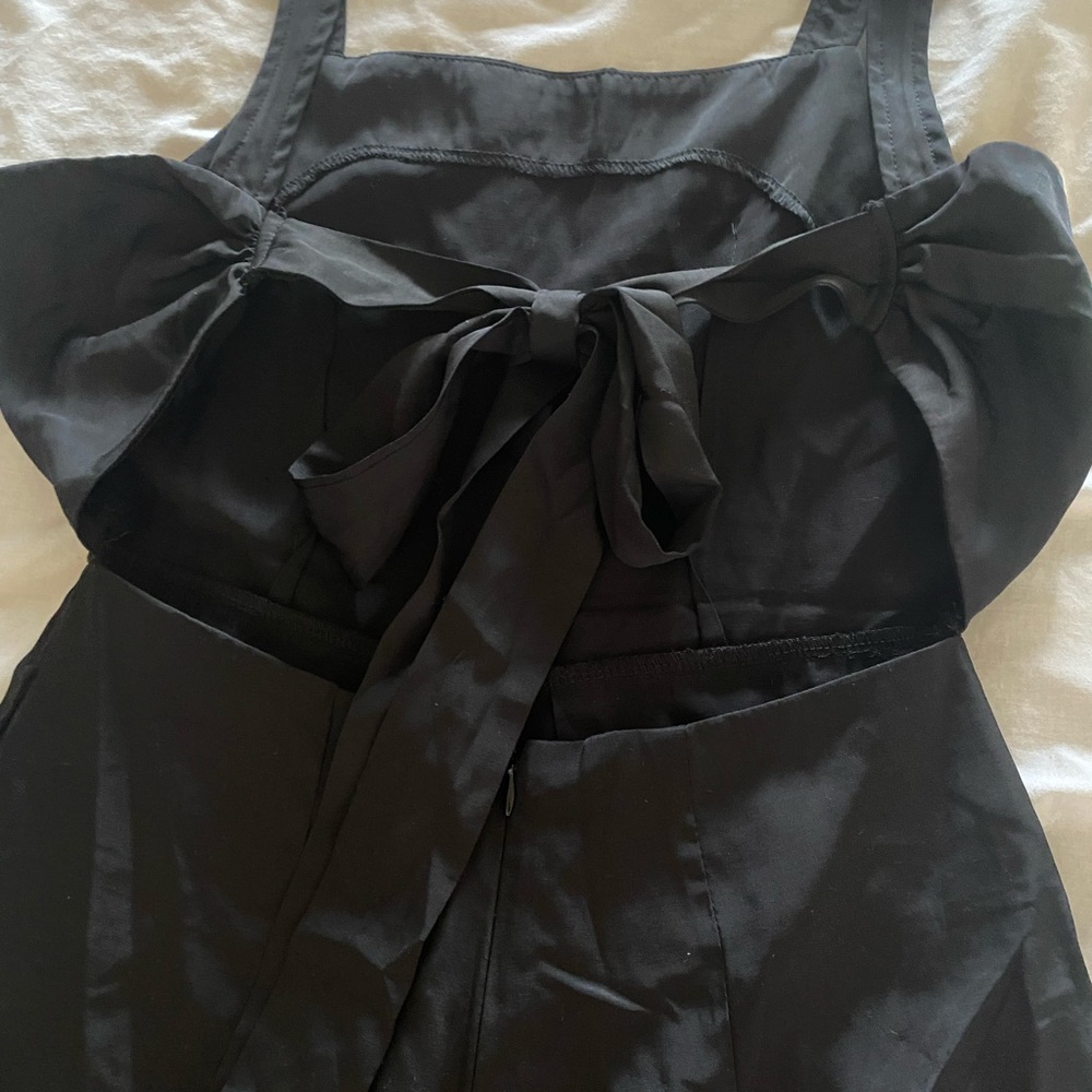 Black romper. Ties in  back. Size small.